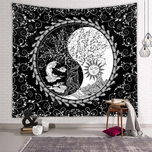 Detail of tree of life tapestry with sun and moon motifs in bohemian home setting