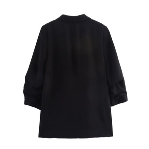 Back view of black casual blazer with pleated sleeves and single button for women