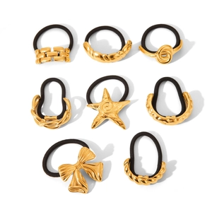 Set of 8 black elastic hair ties featuring various gold metal charms and bows