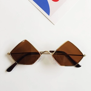 Detailed macro view of vintage geometric diamond metal frame sunglasses with tinted lenses