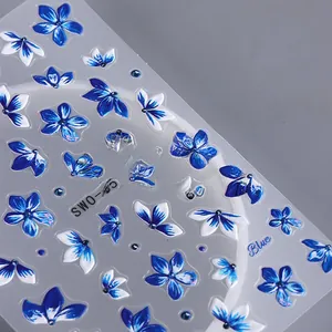 Detail of 3D embossed blue flower nail stickers with realistic petal texture and design