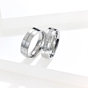 Polished titanium steel couple rings set with cubic zirconia stones for engagement