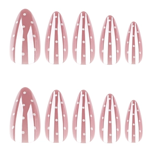 Pink and white vertical striped almond press-on nails with white polka dot accents