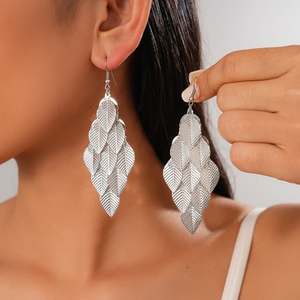 Silver layered leaf drop earrings with delicate metallic texture and elegant fringe