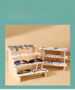 Detail of multi-tier natural pine wood display stand for jewelry and accessories
