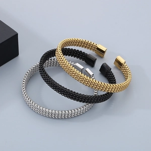 Three-piece set of woven stainless steel C-shaped bracelets in gold, silver, and black finish