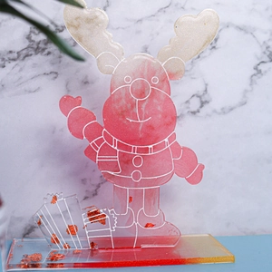 Detailed view of DIY resin Christmas deer ornament with red scarf and gold foil base