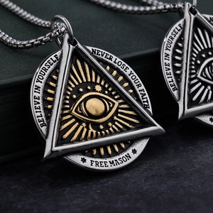 Macro detail of the All-seeing Eye pendant with Believe In Yourself engraving
