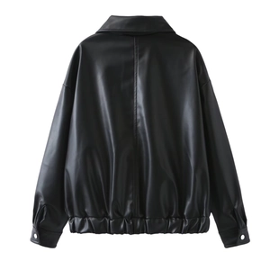 Rear view of a black oversized PU leather jacket showing texture and relaxed silhouette