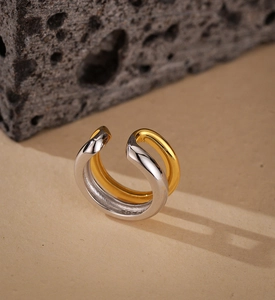 Macro detail of S925 sterling silver double-layered ear cuff with gold and silver finish