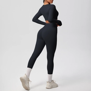 Rear view of tight-fitting black yoga set showing high-waisted leggings and cropped top