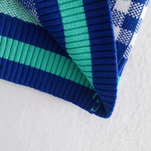 Women's color block knit cardigan with blue, green, and white checkered stripe texture