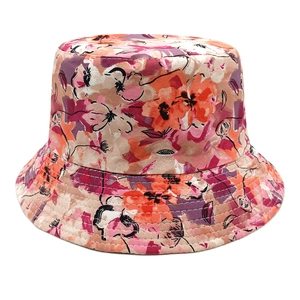 Detail of floral bucket hat showing orange and purple print with precise stitching