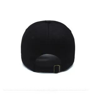 Detail view of the black baseball cap back with adjustable bronze metal buckle strap