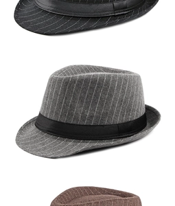 Detailed stack of wool felt jazz hats in black, gray, and brown with striped textures