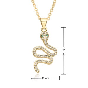 Detailed view of gold snake pendant with micro-paved zircons and 23mm x 13mm size scale