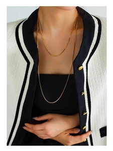 Close-up of elegant 18K gold plated double layer square snake chain necklace on model