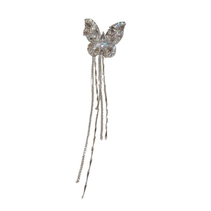 Silver butterfly ear clip with sparkling zircon and long tassel chains on white background