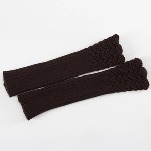 Detail of dark brown ribbed knit arm warmers with scalloped fish-scale edges