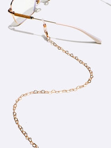 Golden heart-shaped chain eyewear strap with non-slip silicone loops on white background