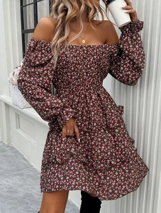 Detail of floral mini dress with elastic square neck and ruffled long sleeve cuffs
