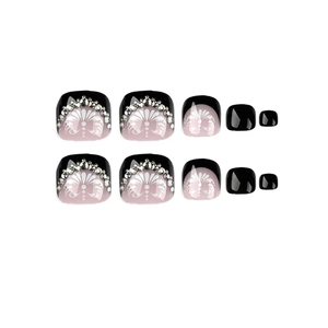 Glossy black French toe press-on nails with white flower patterns and sparkling rhinestones