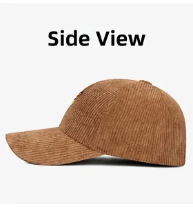 Detail view of the brown corduroy baseball cap side with retro ribbed texture and curved brim