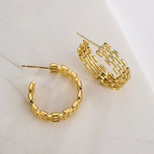 Chic 18K gold plated irregular geometric C-shaped hoop earrings on marble surface