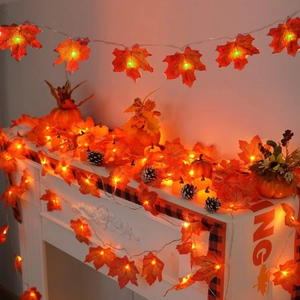 Autumn LED maple leaf string lights with warm glow for festive fireplace decoration