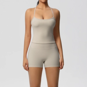 Front view of nude two-piece yoga set with skinny strap tank top and high waist shorts