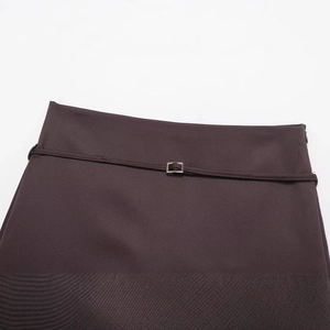 Deep brown skort featuring a waist belt with a square silver metal adjustment buckle