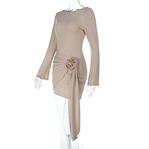 Close-up of apricot mini dress featuring 3D rose flowers and elegant hanging ribbons