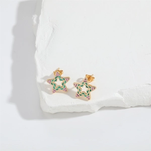 Star shaped gold earrings with green and purple enamel and hollow center design