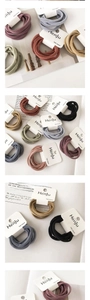 Detail of three seamless high-elastic hair bands in Morandi colors on display card