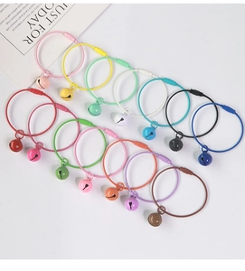 Detailed view of colorful coated wire keychains with matching bells in various macaron tones