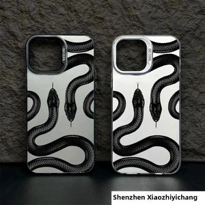 Close-up of dual snake patterned mirror cases for iPhone with silver finish and SO COOL text