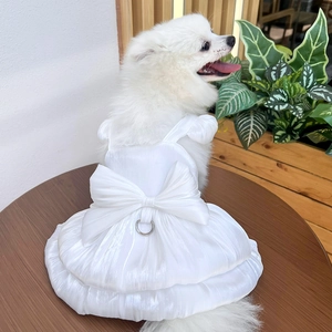 Detail of pet wedding dress featuring silk bow and sturdy metal D-ring for leash