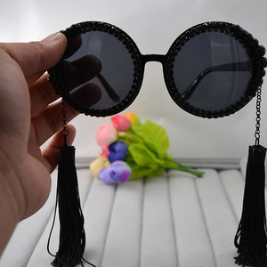 Oversized round sunglasses with black rhinestones and long metal fringe tassels
