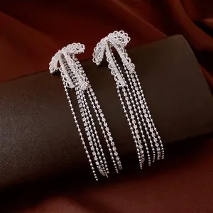 French luxury silver needle bow tassel earrings with micro-pave cubic zirconia crystals