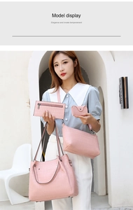 Detailed view of pink crocodile-embossed four-piece handbag set featuring elegant textures