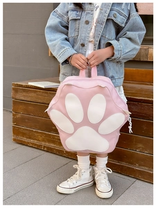 Detailed view of pink and white cat paw shaped kids backpack made of premium PU leather