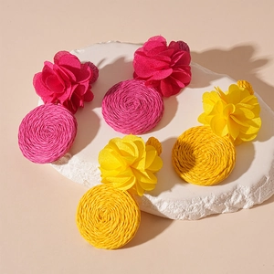 Bohemian raffia woven flower drop earrings in vibrant rose red and yellow floral style