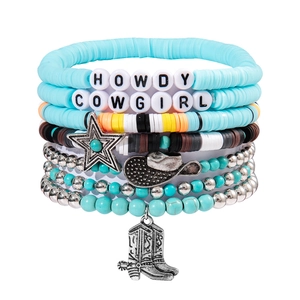 Detail of bohemian multilayer bracelet with turquoise beads and Howdy Cowgirl charms