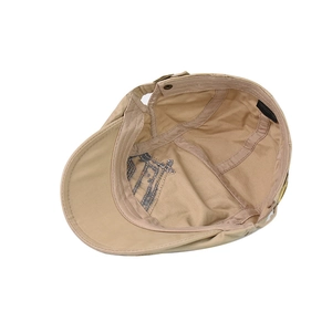 Interior detail showing 100% cotton label and stitching of khaki retro flat cap
