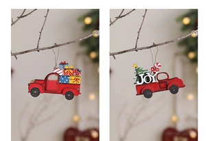 Detail of red vintage wooden truck ornaments with tree and JOY sign on branch