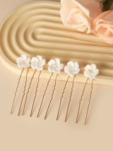 Set of 5 bridal hair pins featuring white ceramic flowers with crystals and gold wavy stems