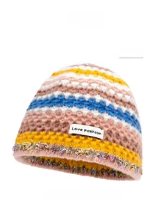 Detailed knit of striped beanie with colorful tassels and Love Fashion patch