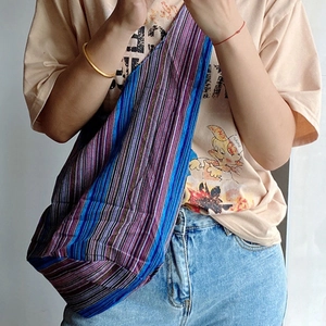 Ethnic bohemian striped woven hobo shoulder bag featuring vibrant multi-color patterns