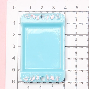 Detailed view of a blue miniature dollhouse tray measuring 6x4cm on a grid mat