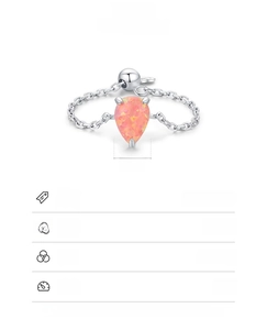 Detail of S925 sterling silver chain ring featuring a teardrop pink opal stone
